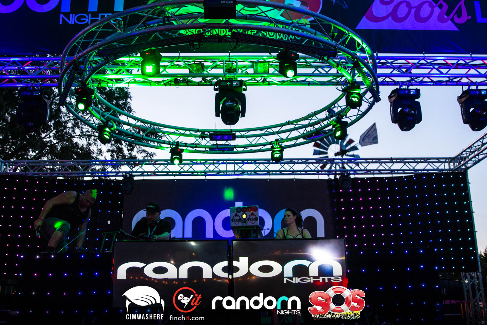 Stage rig glowing above the crowd