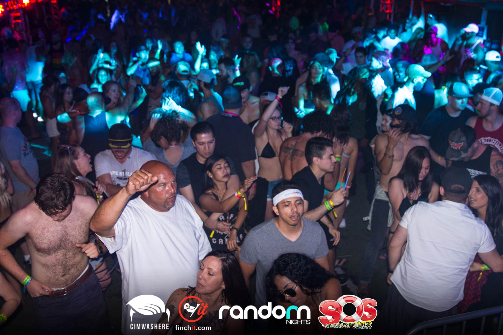 Night crowd under teal light