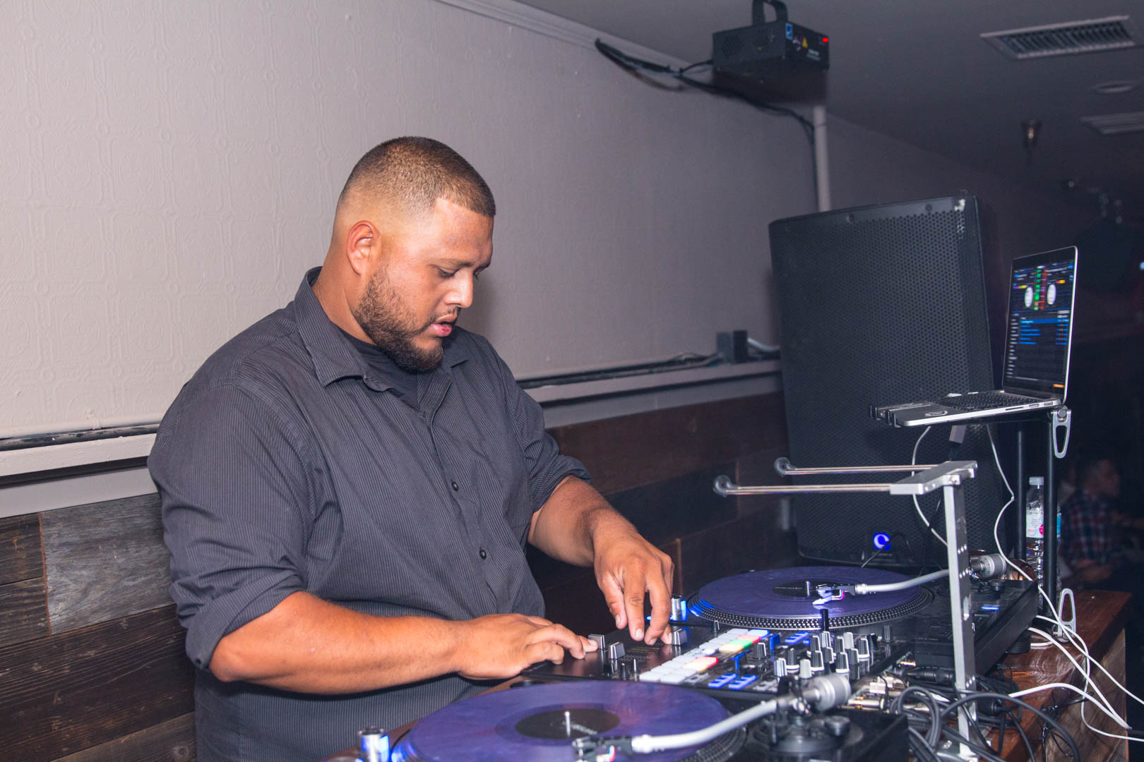 DJ at the mixer in low light