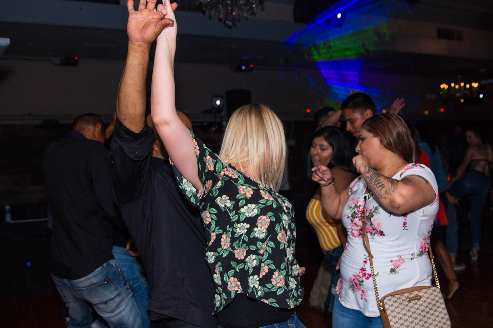 Dance floor moment with raised arm