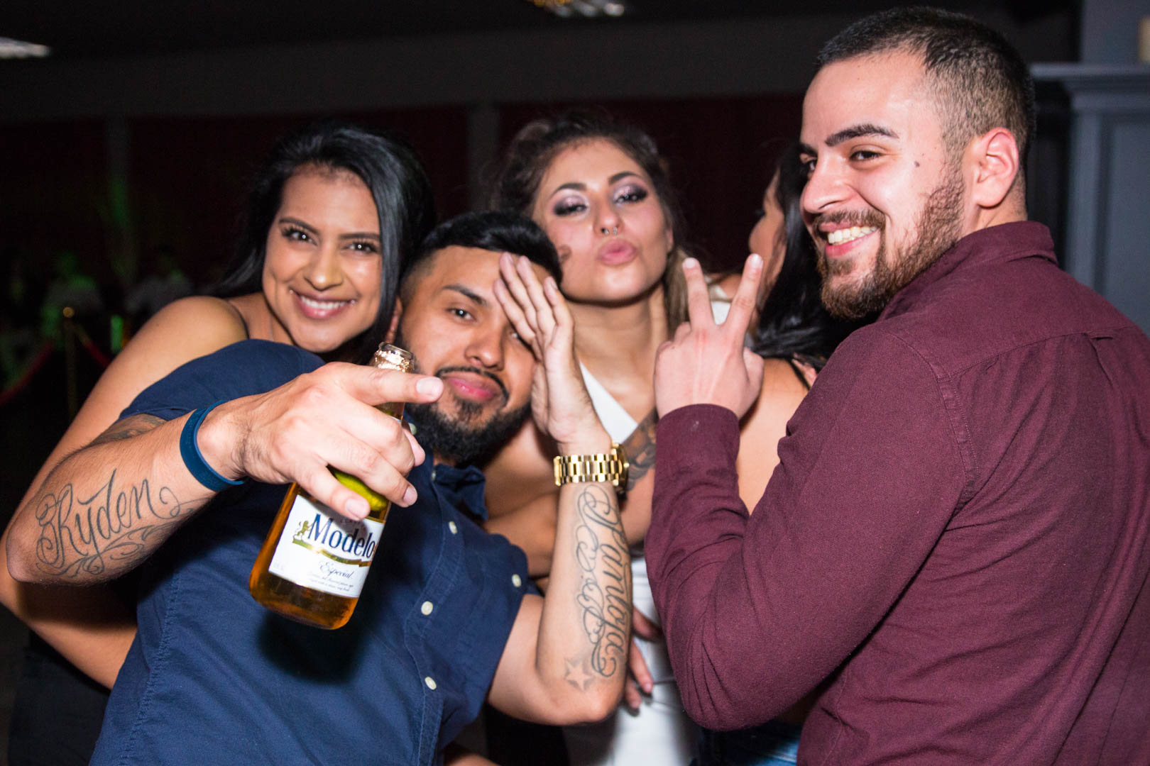 Friends smiling with a bottle